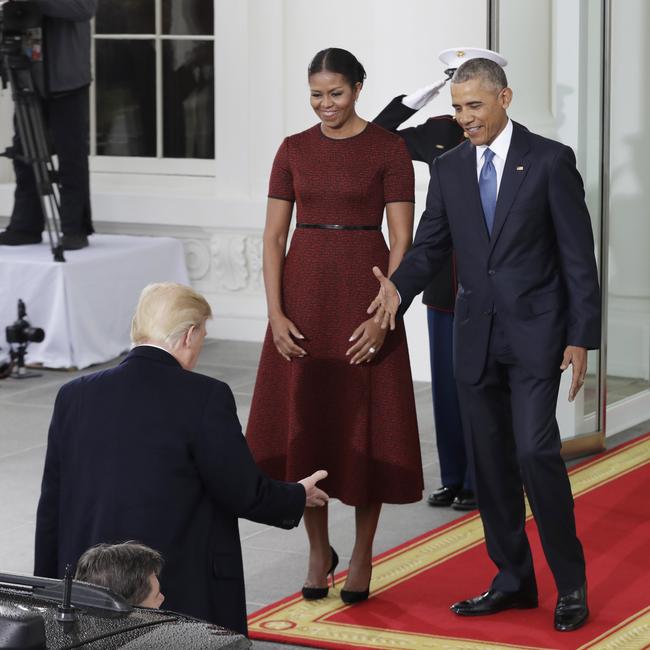 President Barack Obama and first lady Michelle Obama greet incoming President Donald Trump at the White House in Washington on January 20, 2017. Picture: AP
