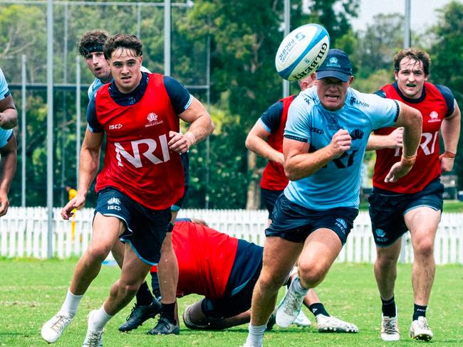 Waratahs five-eighth Tane Edmed chases a kick during training at NSW Rugby's practice field in Daceyville.