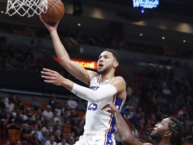 Philadelphia 76ers guard Ben Simmons goes o the hoop against Miami Heat forward Justise Winslow in the first half of an NBA basketball game on Monday, Nov. 12, 2018, in Miami. (AP Photo/Brynn Anderson)