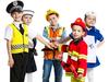 Five kids standing with hands together, each one with a unique profession: policeman, sailor, firefighter, nurse and builder. Studio shot, isolated on white.