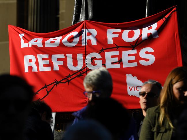 A placard titled 'Labor for Refugees' is seen outside of the State Library of Victoria in Melbourne, Saturday, July 20, 2019. Rallies have taken place in Canberra, Sydney, Melbourne, Brisbane marking six years since offshore detention on Manus and Nauru was implemented. (AAP Image/James Ross) NO ARCHIVING