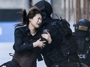 Police attend a siege in the Lindt shop in Sydney's Martin Place. Photos: Chris McKeen