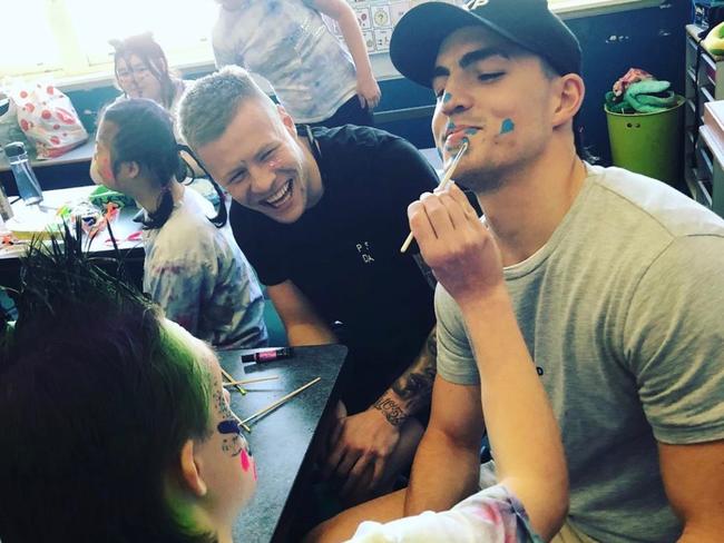 Brayden Maynard and Jordan De Goey enjoy a face painting session.