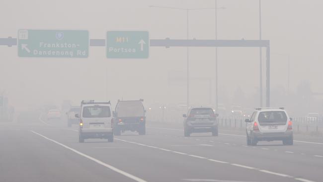 Thick smoke reduced visibility on the Mornington Peninsula Freeway at Frankston North. Picture: Andrew Henshaw