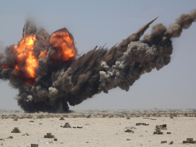 Smoke and fire billow during a controlled explosion by Yemeni experts to destroy explosives and mines laid by Huthi rebels, on April 5, 2016 in the southern city of Aden. Could Middle East tensions explode around the world? Picture: AFP/ SALEH AL-OBEIDI