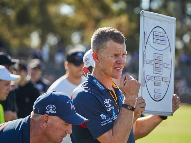 Adelaide Crows SANFL Coach Ryan O'Keefe talking to players at quarter time in the Crows vs Bulldogs match in Elizabeth, Saturday, April 21, 2018. (AAP Image/MATT LOXTON)