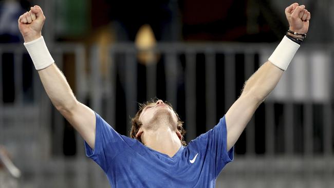 Russia's Andrey Rublev celebrates winning against Canada's Felix Auger-Aliassime during their Adelaide International semi-final. Picture: AP Photo/James Elsby