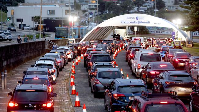 A long queue of cars pictured at the Bondi Beach drive-through Covid testing site this week. Testing for travel has put enormous strain on pathology services. Picture: Damian Shaw