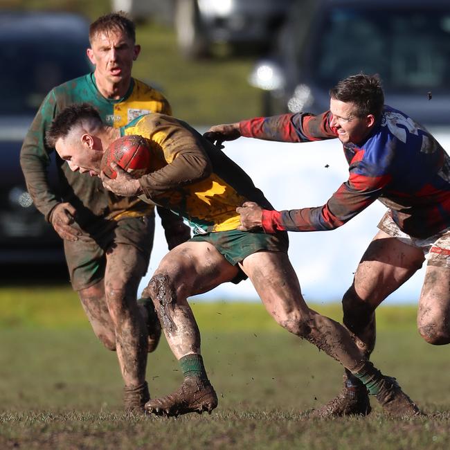 Hepburn’s Bradley McKay makes a valiant attempt to tackle a Gordon opponent.