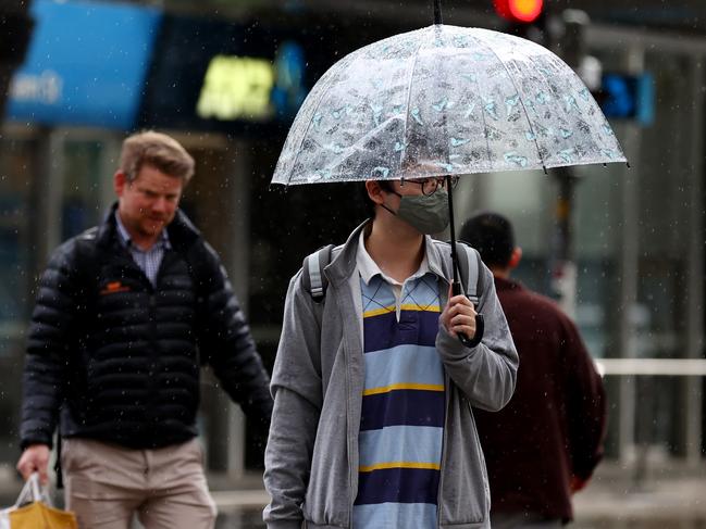 ADELAIDE, AUSTRALIA - NewsWire Photos September 14 2022: Adelaide pedestrians try to keep dry as Adelaide is hit with rain. Picture: NCA NewsWire / Kelly Barnes