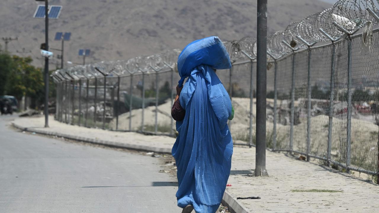 A burqa-clad woman walks along a road in Kabul on July 15, 2021. Picture: Sajjad Hussain/AFP