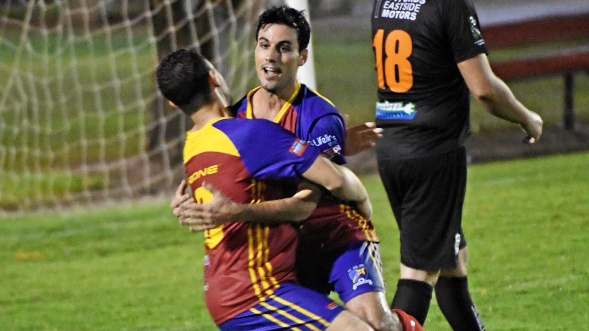 KSS Jets player Liam Previtera embraces Jordan Dowden after Previtera scored to guide the side into the FFA Cup final for Wide Bay. Picture: Shane Jones