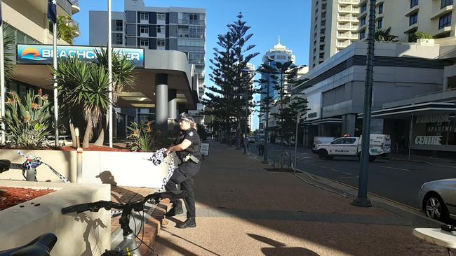 Police removed tape around the scene of a fatal stabbing at Surfers Paradise just before 8am on Wednesday morning.