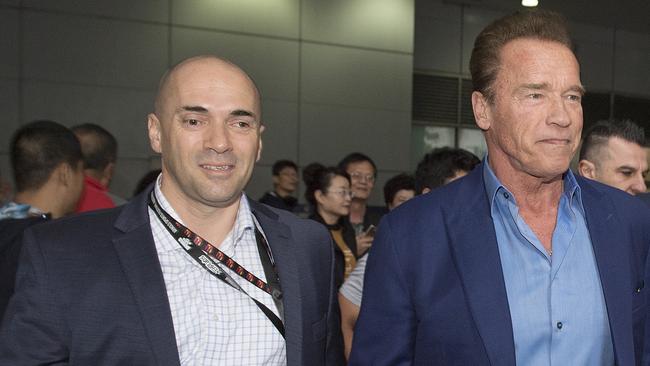 Harry Korras accompanies Arnold Schwarzenegger at last weekend’s Arnold Classic in Melbourne. Picture: AAP/Ellen Smith