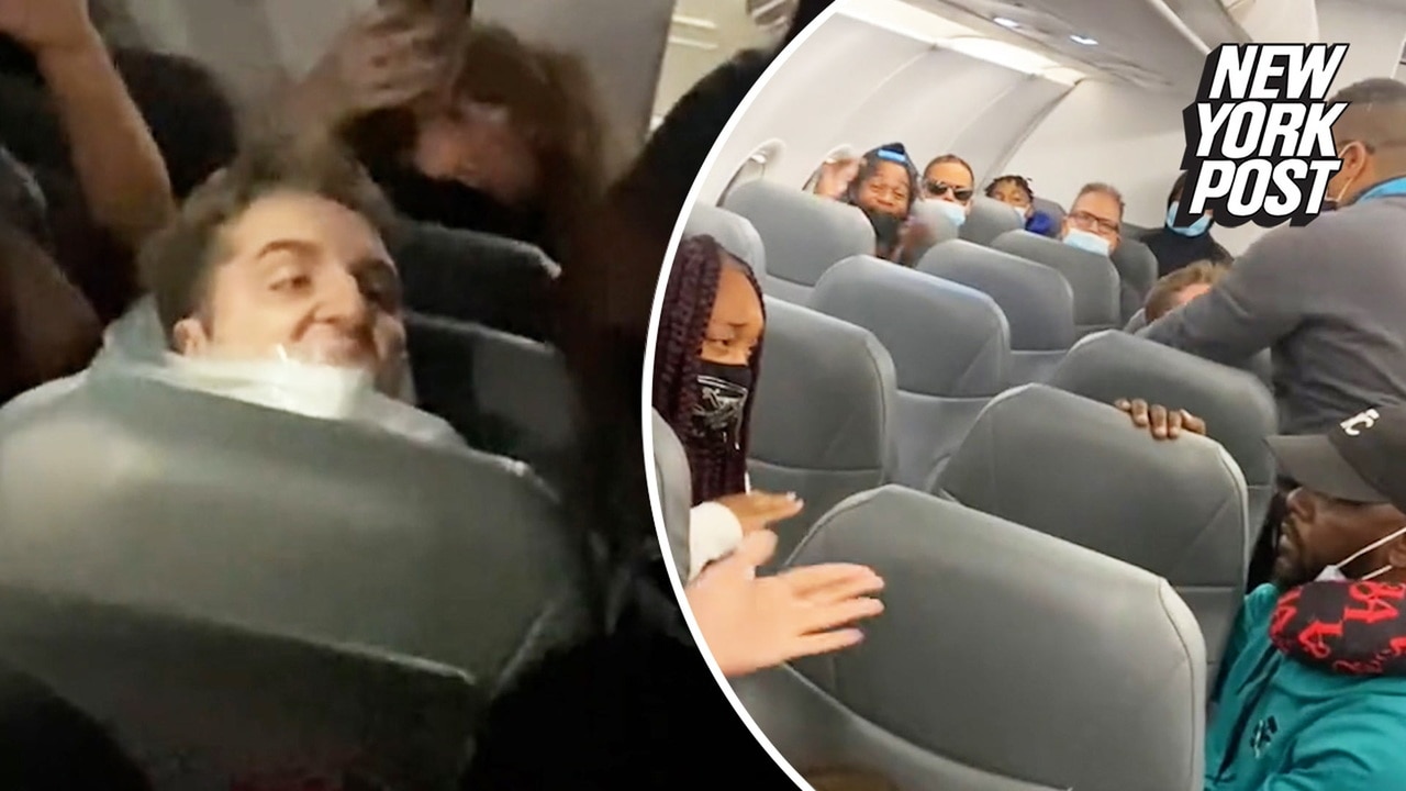 Couple gets engaged while unruly plane passenger is duct-taped to his seat