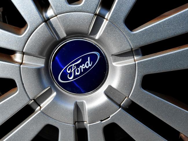 (FILES) In this file photo taken on February 18, 2019 the logo of US auto-maker Ford is seen on a car in Blanquefort, southwestern France. - Ford announced on February 4, 2021 that it is accelerating its investment ramp-up in electric cars, but cautioned that the industry-wide shortage of semiconductors would pinch profits in 2021. The US auto giant said it plans $22 billion in electric car investment through 2025, nearly twice the earlier plan. (Photo by GEORGES GOBET / AFP)