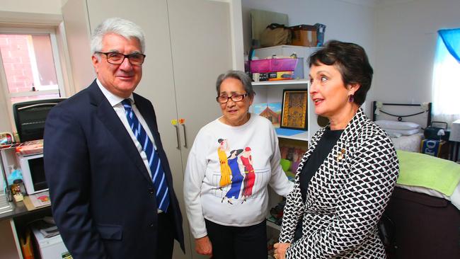 Pru Goward speaks with Bridge Housing CEO John Nicholades and tenant Anne Grizonic at an Ashfield boarding home.