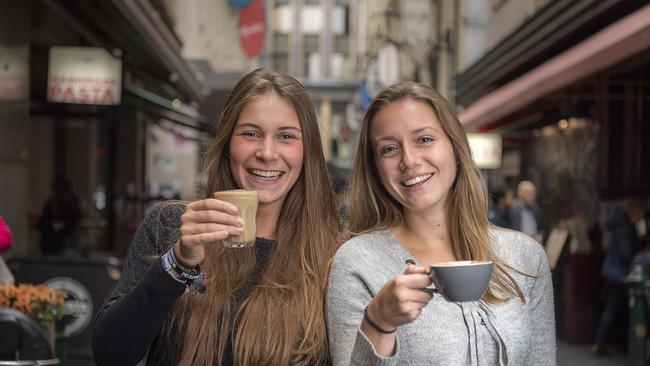 Maud Alexis, 18 and Julie De Pauw, 21 enjoying a coffee in Degraves St. Picture: Jason Edwards