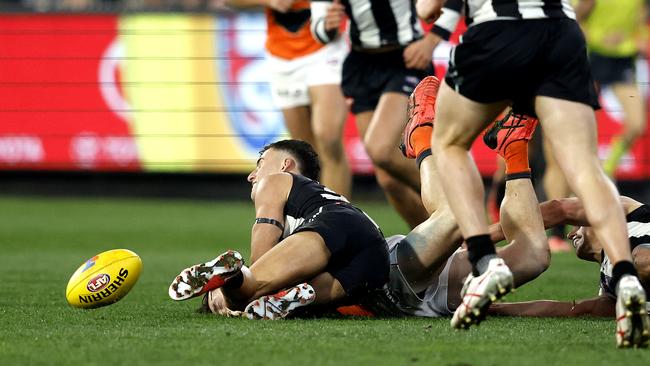 Nick Daicos faces a nervous wait after this tackle. Picture: Phil Hillyard