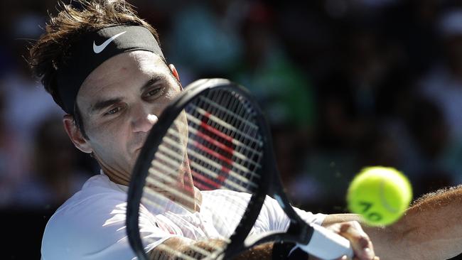 Roger Federer cracks a forehand against Marton Fucsovics. Picture: AP