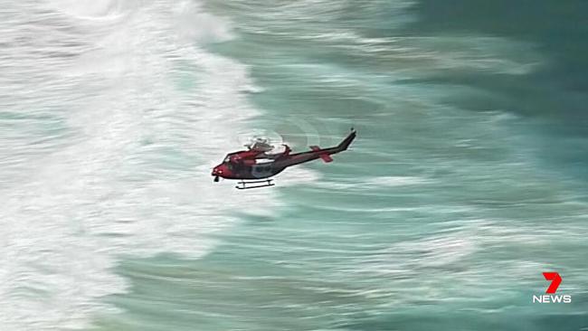 A helicopter searches for the missing man. Picture: 7News