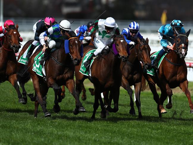 Garner (second left), ridden by Dwayne Dunn, wins the Punters.com.au Living Legends Plate.