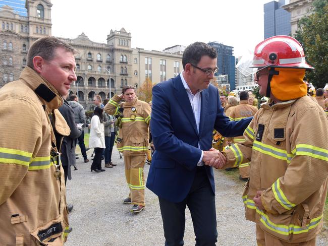 Victorian Premier Daniel Andrews greets volunteer and paid firefighters speak to media in Melbourne, Friday, June, 10, 2016. (AAP Image/Tracey Nearmy) NO ARCHIVING