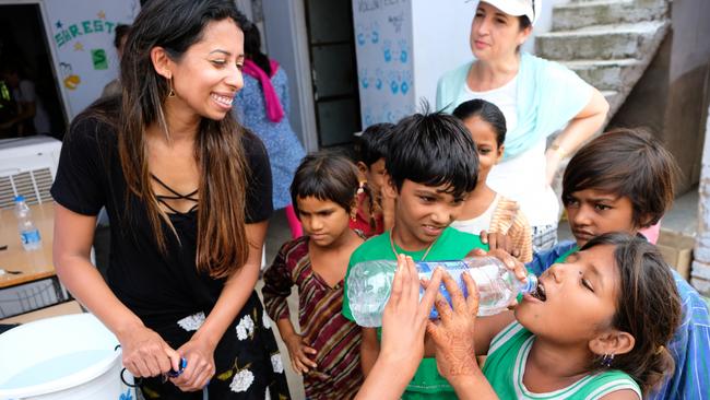 Hands on Journeys Empowerment Tourism company owner Simla Sooboodoo with the kids from Shrestha Centre. Photo: Whitney Taylor