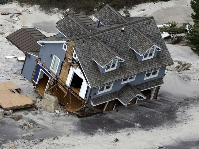 Extreme...A collapsed house along the central Jersey Shore coast because of Hurricane Sandy which experts believe was an example of extreme weather events due to the world geting warmer. Picture:AP/Mike Groll