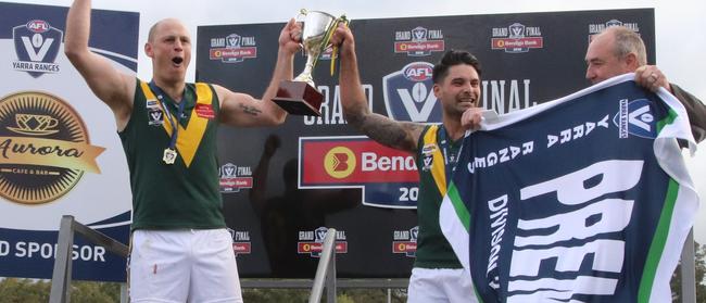 Yarra Junction celebrates: John Holmes and Alan Chandler raise the AFL Yarra Ranges Division 2 silverware.   Picture: Bethany Hutchison