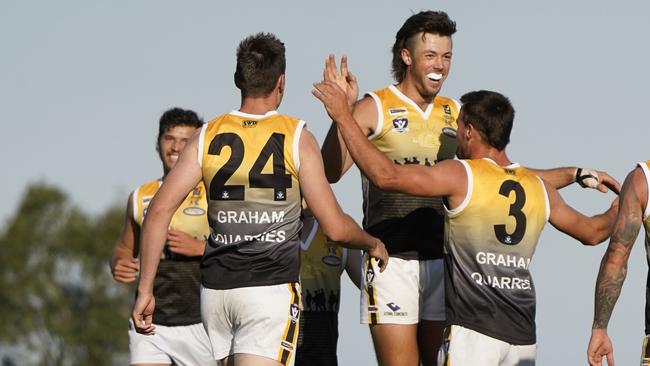 MPNFL football: Frankston Bombers v Frankston YCW. YCW players celebrate the goal of Zachary Barrett. Picture: Valeriu Campan