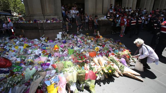 Flowers at a public memorial site for the Bourke St tragedy. Picture: David Crosling