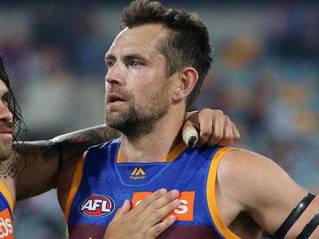 BRISBANE, AUSTRALIA - SEPTEMBER 14: Allen Christensen of the Lions consoles Luke Hodge after the loss during the AFL Semi Final match between the Brisbane Lions and the Greater Western Sydney Giants at The Gabba on September 14, 2019 in Brisbane, Australia. (Photo by Jono Searle/AFL Photos/via Getty Images)