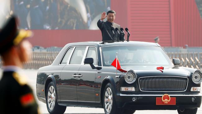 Chinese President Xi Jinping waves from a vehicle as he reviews the troops at a military parade marking the 70th founding anniversary of People's Republic of China, on its National Day in Beijing last October.