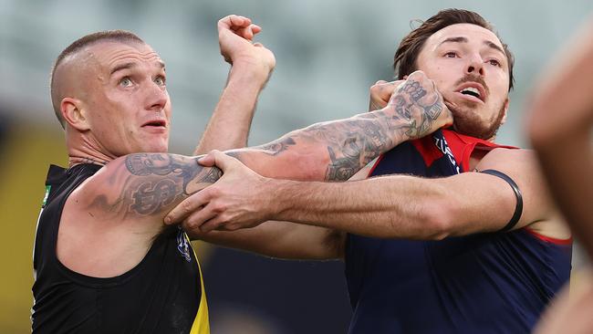 Tigers star Dustin Martin wrestles with Michael Hibberd for position Picture: Michael Klein