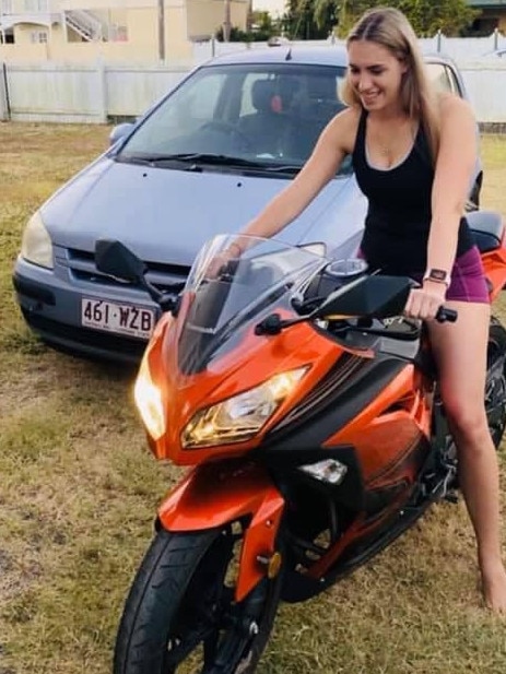 Jennifer Board on the motorcycle she was riding when she was struck and killed in Townsville on Friday. Speculation is mounting around the circumstances of her tragic passing.