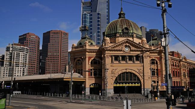 Empty streets around Flinders Street Station last weekend. Picture: AAP Image/Scott Barbour