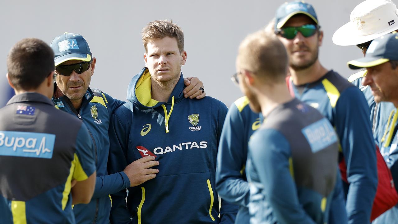 Justin Langer consoles a glum-looking Steve Smith in Leeds.