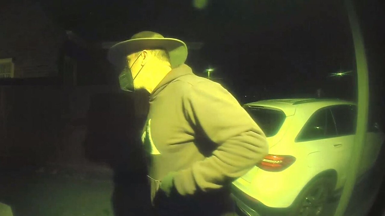 In one CCTV video clip, the man is pictured fleeing the premises after a dog approaches him. Picture: Victoria Police