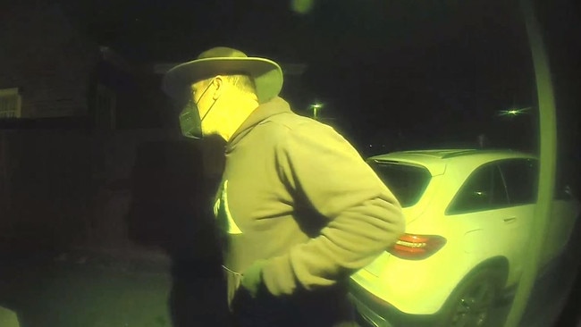In one CCTV video clip, the man is pictured fleeing the premises after a dog approaches him. Picture: Victoria Police