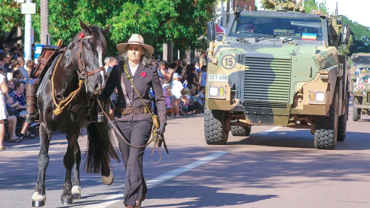 The riderless horse leads the march on Darwin's Knuckey St commemorating ANZAC Day 2021. Picture Glenn Campbell