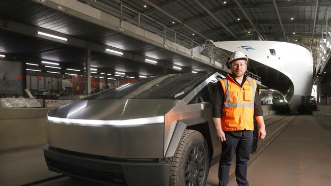 Incat’s Tom Cooper with the Cybertruck and the boatbuilder’s first electric ferry. Picture: Nikki Davis-Jones