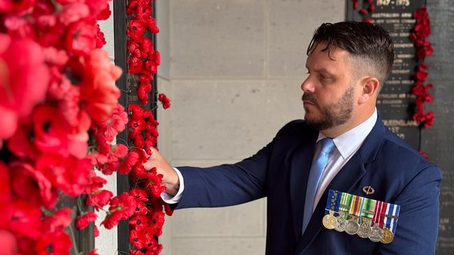 Mr Thompson, a former iRAR soldier, visits a war memorial