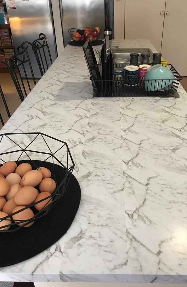 Kezz's newest kitchen bench with marble-style contact.