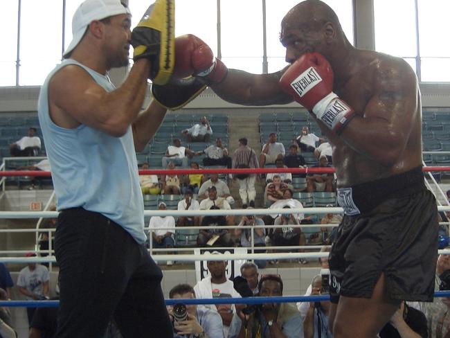 Fenech holds pads for Tyson. Picture: Supplied