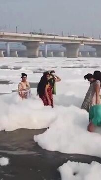 Devout Hindus bathe in toxic foam river 