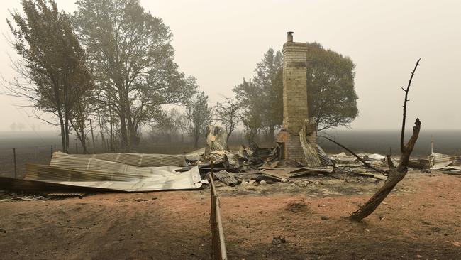 Locals return to Cudgewa to assess the damage. Picture: Tony Gough