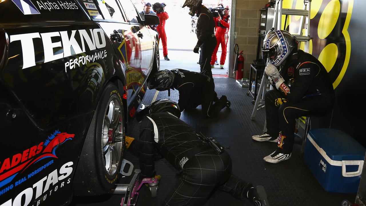 A dejected Shane van Gisbergen sits in his garage after his 2014 heartbreak. Picture: Robert Cianflone