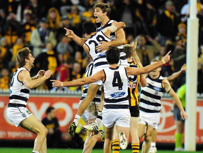 Hawkins and teammates react after his post-siren goal to down the Hawks in 2012. Picture. George Salpigtidis