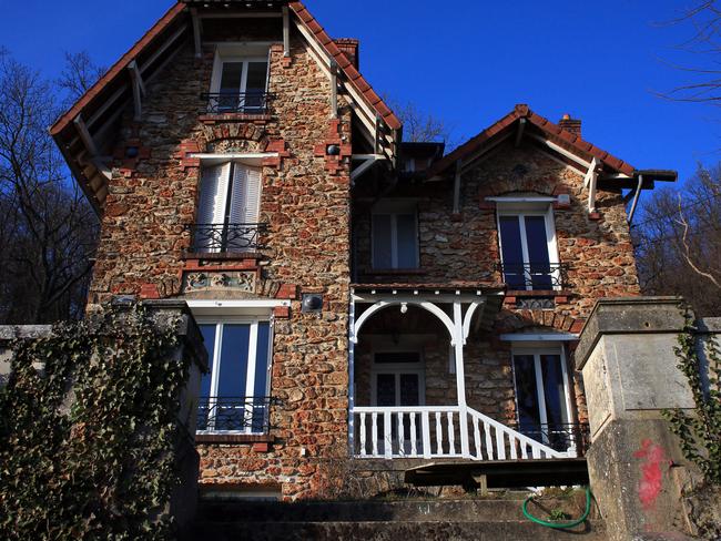 The Airbnb rental property where a decomposing body of a woman was found in the garden, in Palaiseau, south of Paris, France, Monday, Feb. 29, 2016. Bertrand Daillie, the deputy prosecutor for Evry, said a group of young people who were renting the house for a weekend discovered the badly decomposed body in the garden near the edge of the property. He says it was covered by tree branches that had been placed there deliberately. (AP Photo/Thibault Camus)
